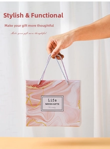 Pink marble gift bag with woven handles and golden lines for elegant tulip mug set