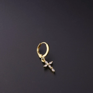 Golden huggie earring with a cross pendant featuring four marquise-cut zircons on black background