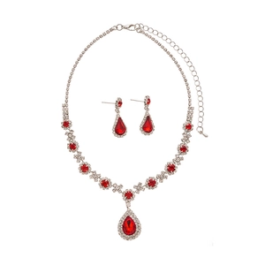 Elegant silver necklace and waterdrop earrings set with sparkling red crystals