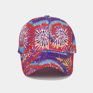 Close-up of vibrant rainbow tie-dye baseball cap with detailed stitching and canvas texture