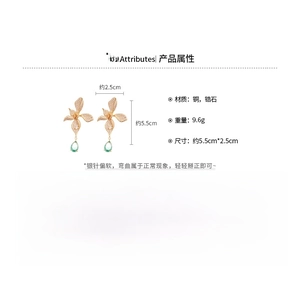Detailed view of 18k gold plated drop earrings with zircon flowers and green waterdrops