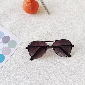 Detailed top view of kids aviator sunglasses with dark metal frame on a white background