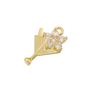 Macro view of a gold cocktail glass pendant with sparkling clear zircon flower details