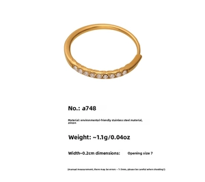 Macro detail of 18k gold plated stainless steel ring set with sparkling 5A cubic zirconia