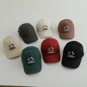 Set of 7 colored cotton baseball caps for kids featuring smile face embroidery
