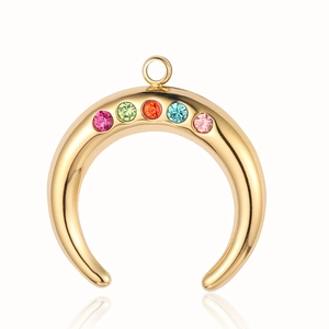 Close-up of golden crescent moon pendant with five colorful gemstones on a white background