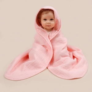 Close-up of pink four-layer cotton gauze hooded baby towel with premium piping details