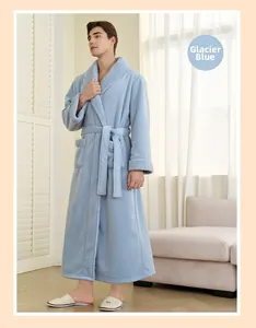 Detail of glacial blue plush bathrobe featuring soft white faux fur trim and waist tie