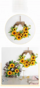 Detail of sunflower wreath with faux greenery and burlap bow on a rustic grapevine base