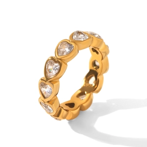 Macro detail of gold-plated eternity ring with heart-shaped cubic zirconia stones