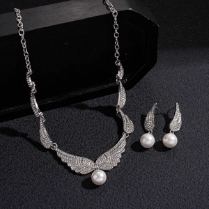 Elegant silver wing jewelry set with sparkling rhinestones and white round pearls