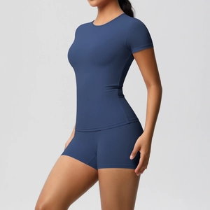 Detail of navy blue high-elastic fitness set featuring slim fit T-shirt and yoga shorts