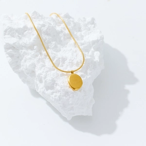 Minimalist 18k gold plated stainless steel necklace with engraved oval pendant on stone