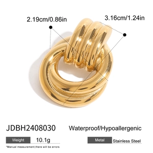 Detail of geometric spiral brooch in gold-plated stainless steel with size dimensions