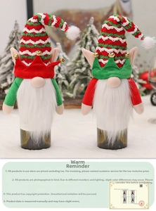 Detail of Christmas gnome wine bottle covers with knitted hats and bells for table decor
