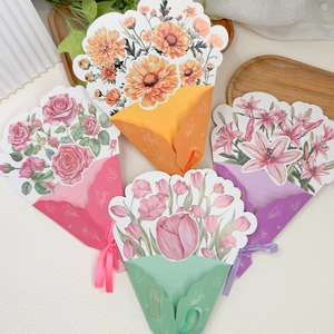 Flat lay of colorful 3D bouquet greeting cards with ribbons for Mother's Day and birthdays