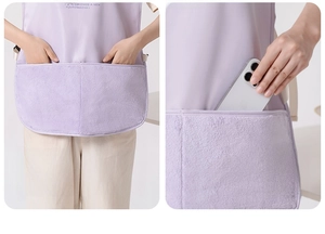 Detail of waterproof apron featuring large divided pockets with absorbent towel fabric