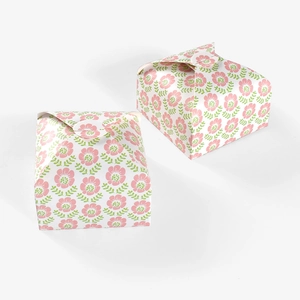 Detail of two vintage floral paper gift boxes with pink flowers and green leaves