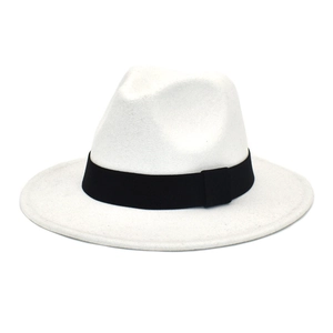 Detailed view of a white wool fedora with a wide black grosgrain ribbon band and flat brim