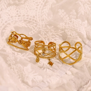 Three-piece set of 18K gold-plated adjustable rings with star charm and floral designs
