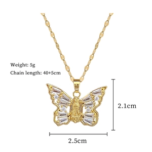 Detailed size view of a gold butterfly necklace with zircon stones and religious motif