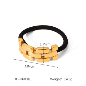 Detail of black elastic hair tie with three-layer golden metal link ornament, 4.04cm wide