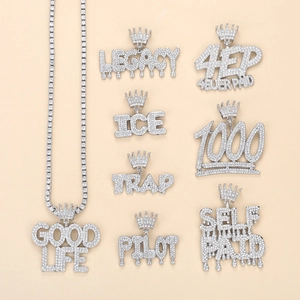 Hip hop jewelry set featuring iced-out crown letter pendants and shiny tennis chain