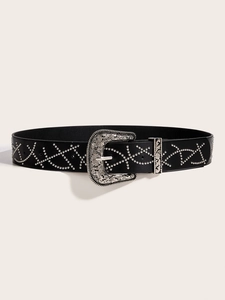 Detail of black punk leather belt with silver rivets and floral engraved western buckle