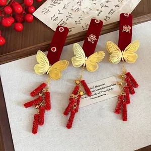 Chinese New Year flocked red butterfly hair clips with festive firecracker tassel design