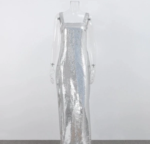 Detail of silver sequined evening dress featuring square neckline and wide straps