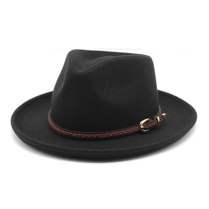 Close-up of black wool fedora featuring a brown braided leather band and gold buckle detail