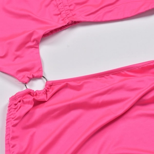 Detail view of pink knit fabric with metal ring connector and drawstring ruched texture