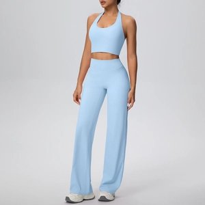 Detailed view of light blue halter-neck sports bra and flare yoga pants set for women