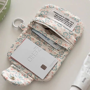 Floral canvas coin purse with multiple compartments and zipper for organized daily storage