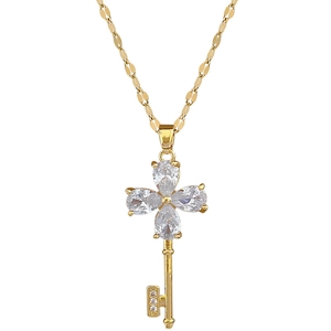Luxurious gold-plated necklace featuring a four-leaf flower and key pendant with gemstones