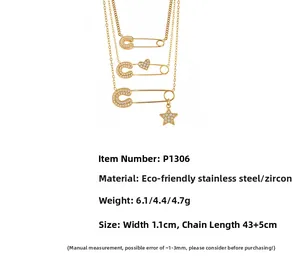 Detail view of 18k gold plated stainless steel paperclip necklaces with zircon charms