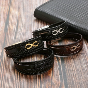 Close-up of multilayer braided leather bracelets with infinity metal magnetic clasps