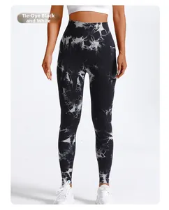 Detail of high waisted tie-dye black and white yoga leggings with functional side pockets