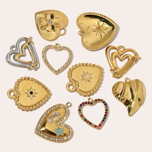 Various French-style hollow heart pendants with crystals in gold and silver finish
