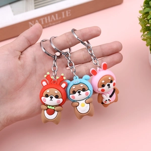 Cute Shiba Inu keychain set featuring reindeer, hoodie, and rabbit ear outfits in PVC