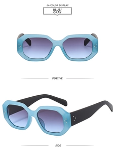 Detail view of light blue geometric polygon sunglasses with grey purple gradient lenses