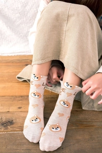 Detail of beige cotton crew socks featuring a cute Shiba Inu print and LOVE lettering
