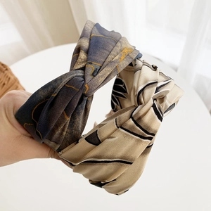 Tie-dye cross knotted wide headbands in dark blue gold and beige leaf patterns