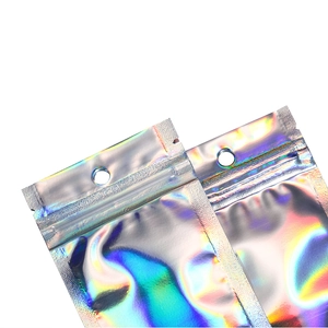 Close-up of holographic silver resealable bags with rainbow reflection and hanging hole