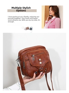 Détail du sac bandoulière vintage en cuir souple marron avec zips et rivets argentés
