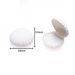 White shell-shaped velvet jewelry box showing open and closed states with 58mm dimensions