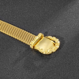 Gold stainless steel snake bone belt bracelet with multiple skull embossed buckle
