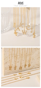 Close-up of gold plated initial pendant necklaces with sparkling zircon pavé detail