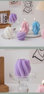 Close-up of modern spiral geometric candles in multiple colors for home decor