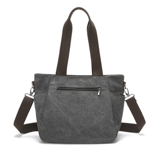 Minimalist dark grey canvas tote bag with adjustable shoulder straps and side pockets